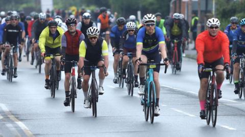 A group of cyclists in Epping, Essex, during RideLondon 2024