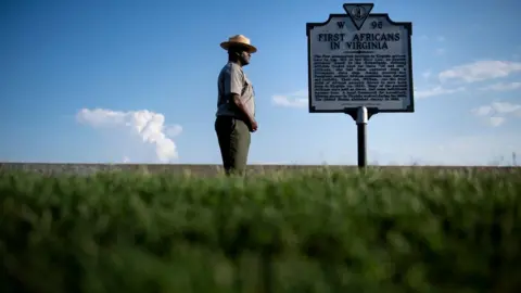 Getty Images Sign marking point where African slaves were first brought to the US