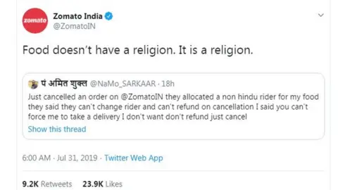 Twitter Tweet by @ZomatoIn stating: "Food doesn't have a religion. It is a religion". It is quote tweeting a tweet by @NaMo_SARKAAR which states: "Just cancelled an order on @ZomatoIN they allocated a non hindu rider for my food they said they can't change rider and can't refund on cancellation I said you can't force me to take a delivery I don't want don't refund just cancel