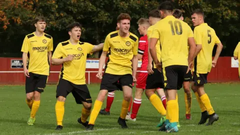 Mac Morgan Ynysddu Welfare players celebrate their victory
