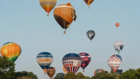 Longleat/Tom Anders Hot air balloons in the sky