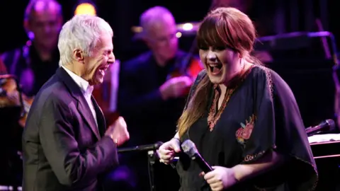 PA Media Adele on stage performing with Burt Bacharach and the BBC Concert Orchestra, to launch the BBC Electric Proms series, at the Roundhouse, Chalk Farm Road, north London, in 2008