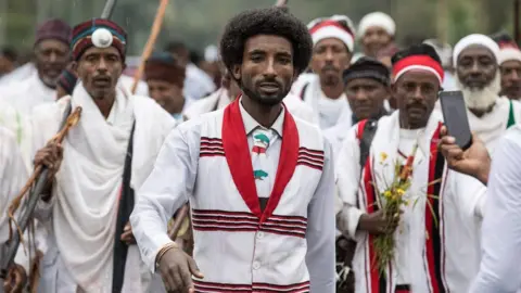 AFP Men march at the Irreecha festival in Ethiopia - Sunday 1 October 2017