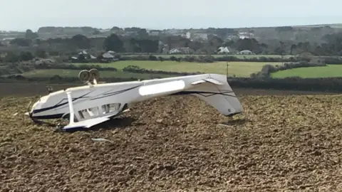Alamy Light aircraft in field in Cornwall