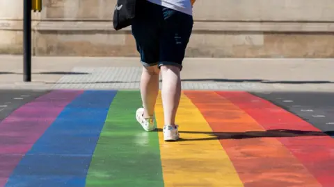 Getty Images Person walking over the rainbow crossing in Battersea