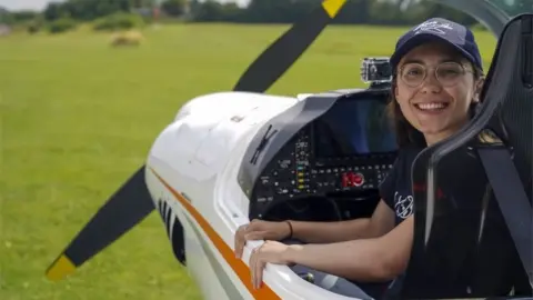 PA Media Zara Rutherford in the cockpit of her plane