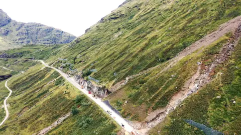 BBC The damaged section of the A83, with the Old Military Road below