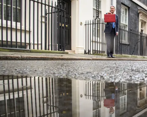 Leon Neal/Getty Images Philip Hammond in Downing Street