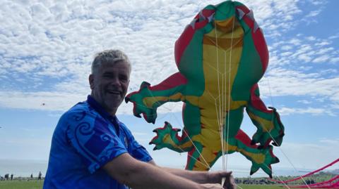 Mark Jones and Crocodile Rick kite flying behind him