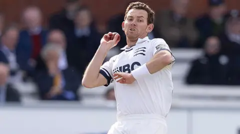 Ryan Higgins runs in to delivery another ball on his way to figures of 3-39 for Middlesex against Worcestershire at Lord's.