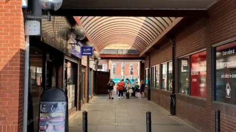A pedestrian route through a shopping street
