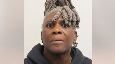 A custody photo of Janice Nix. She is wearing a black hooded top. 