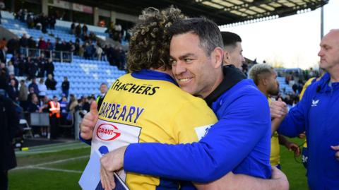 Johann van Graan hugs Alfie Barbeary at full-time