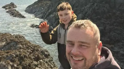 Andrew Jones Celyn, 12, and dad Andrew at Porth y Nant on the north western coast of Anglesey