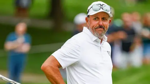 Phil Mickleson of LIV team HyFlyers GC reacts to his missed putt on the 16th green during LIV Michigan at The Cardinal at Saint John's