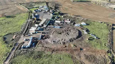 A large illegal waste pile at Raspberry Hill Park Farm