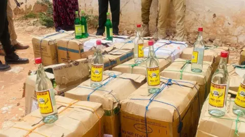 Somalia Police Bottles of intoxicant  connected  apical  of boxes