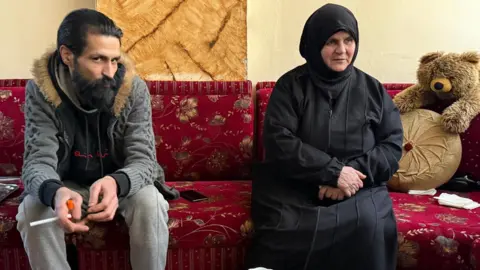 BBC Mother Mazen, wearing a black dress and hijab, still does not know the fate of two of her sons who were arrested during the pro-democracy protests.