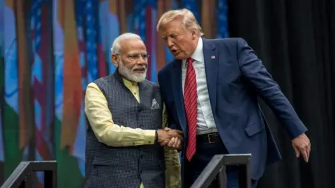 Indian Prime Minister Narendra Modi and U.S. President Donald Trump leave the stage at NRG Stadium after a rally on September 22, 2019 in Houston, Texas. The rally was expected to draw tens of thousands of Indian-Americans and comes ahead of Modi's trip to New York for the United Nations General Assembly.