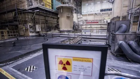 Akos Stiller/Bloomberg via Getty Images A warning sign stands inside the reactor room at the Paks nuclear power plant