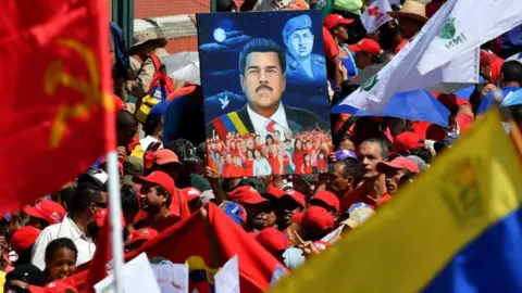AFP Supporters of Venezuelan President Nicolas Maduro gather to mark the 20th anniversary of the rise of power of the late Hugo Chavez, the leftist firebrand who installed a socialist government, in Caracas on February 2, 2019