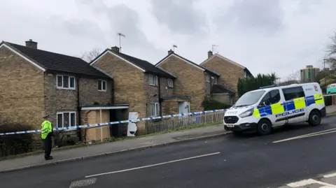 Police cordon outside damaged property