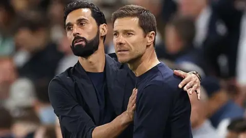 Fulham manager Alvaro Arbeloa and his Chelsea counterpart Xabi Alonso embrace at Craven Cottage