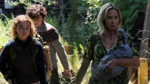 Jonny Cournoyer/Paramount Millicent Simmonds, Noah Jupe and Emily Blunt in A Quiet Place Part II