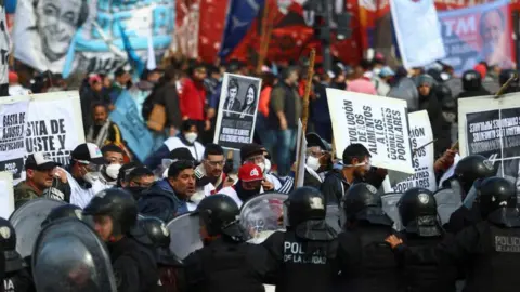 Reuters Demonstrators protest against Argentine President Milei's economic plan, in Buenos Aires