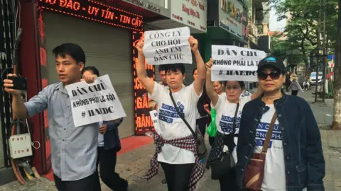 AFP Demonstrators holding placards marched towards the courthouse in Hanoi on 5 April 2018