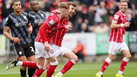 Getty Images Bristol City players celebrate their second goal against Rotherham at Ashton Gate