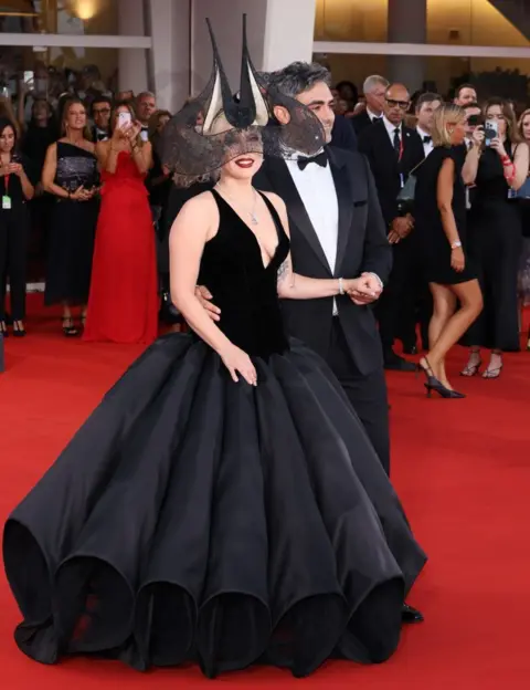 Getty Images Lady Gaga and Michael Polansky on the red carpet