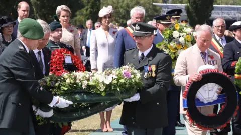 AFP/Getty Images Wreaths were laid by both the Belgian and British royal families