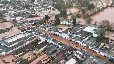 Aerial footage shows flooded streets and fields in Monmouth
