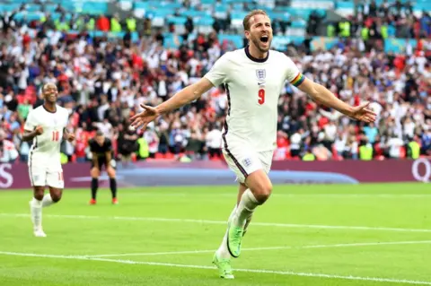 Catherine Ivill/Getty Images Harry Kane celebrates after scoring during a Euro 2020 match between England and Germany at Wembley Stadium in June 2021