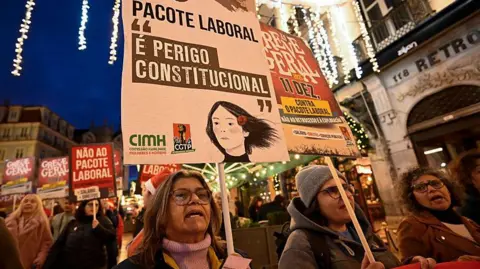 Corbis via Getty Images Women march in Lisbon against the government's labour package