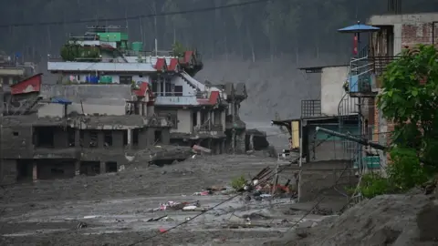 Getty Images Mudslide damaging properties.
