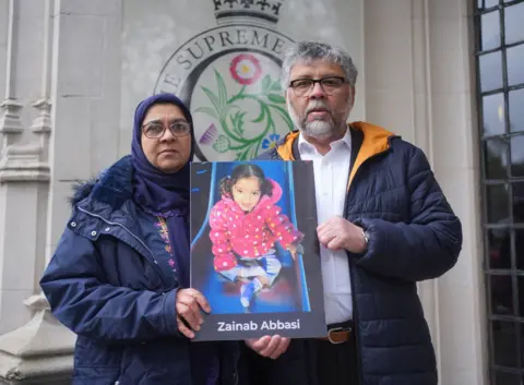 Yui Mok/PA Wire Rashid and Aliya Abbasi, the parents of Zainab Abbasi