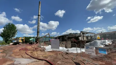 Robby West/BBC The former Van Dal shoe factory on Dibden Road in Norwich, where demolition took place earlier in the year to clear the site.