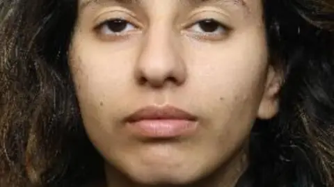 South Yorkshire Police A police mugshot of Paris Askew. She is looking straight at the camera. She has long wavy brown hair and brown eyes.