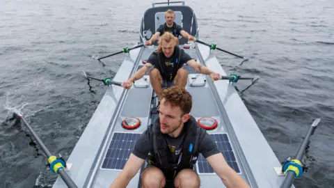MacLean brothers Jamie, Ewan and Lachlan MacLean rowing in their carbon fibre boat.