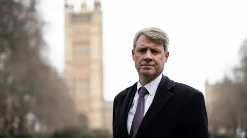 PA Media Chris Skidmore on College Green in London