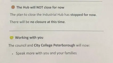 HAYLEY JANCESKI A white piece of paper with brown bullet point next to the words: "The Hub will NOT close for now. The plan to close the Industrial Hub has stopped for now. There will be no closure at this time."