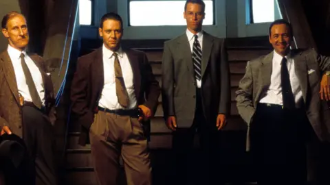 Warner Brothers/Getty Images (Left to right) James Cromwell, Russell Crowe, Guy Pearce and Kevin Spacey in a publicity portrait for the film LA Confidential, in 1997