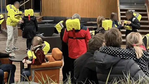 Stephen Kearney People put on life jackets