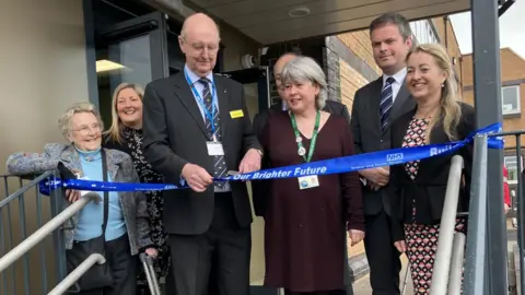 BBC Officials cut the ribbon to open the new operating theatres