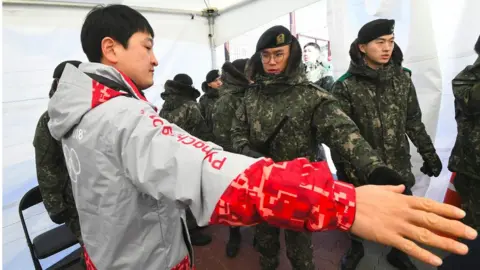 AFP man being frisked by soldier