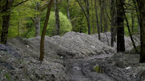 PA Piles of waste in Hoads Wood in Kent