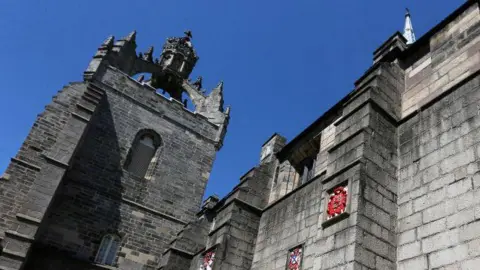 PA Media King's College Chapel, University of Aberdeen, grand grey building under a blue sky.