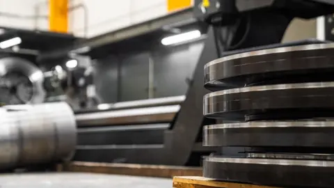 Bowers & Jones A close up of the inside of a metal rolling factory